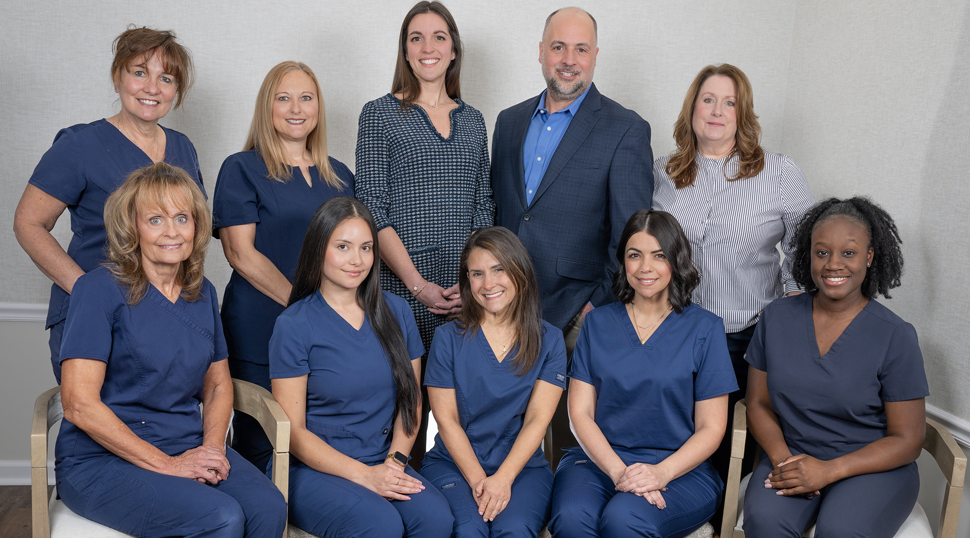 The Clark Family Dental Associates team, including Dr. Robert Martino and Dr. Allison Sceppaguercio, in the Clark, NJ office.